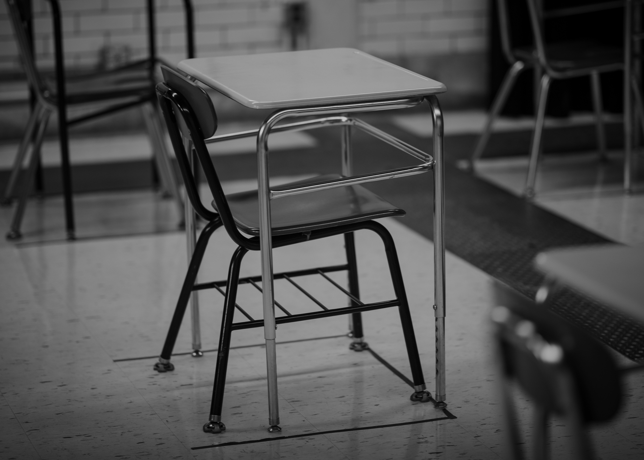 An empty desk sits in a classroom in Fairhaven, High School, Fairhaven, Massachusetts.